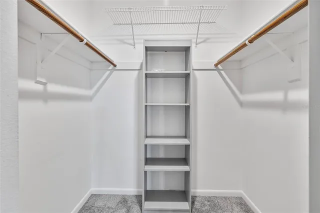 a view of an empty walk in closet