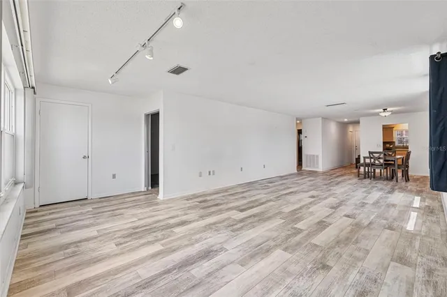 a view of a livingroom with furniture and a flat screen tv