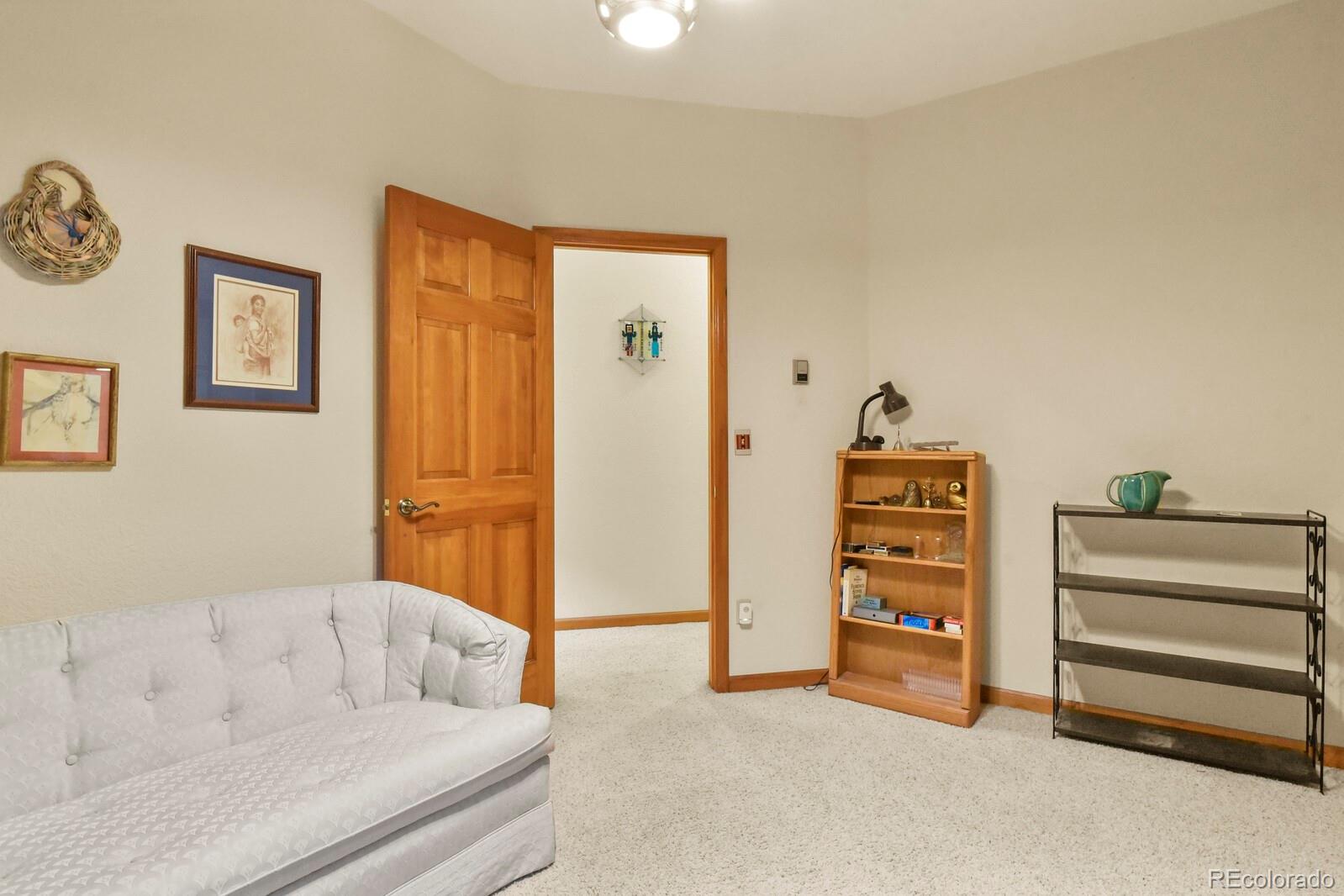 19085 Merry Men Circle Monument, CO 80132 - Photo 17 of 50 a living room with furniture and a closet