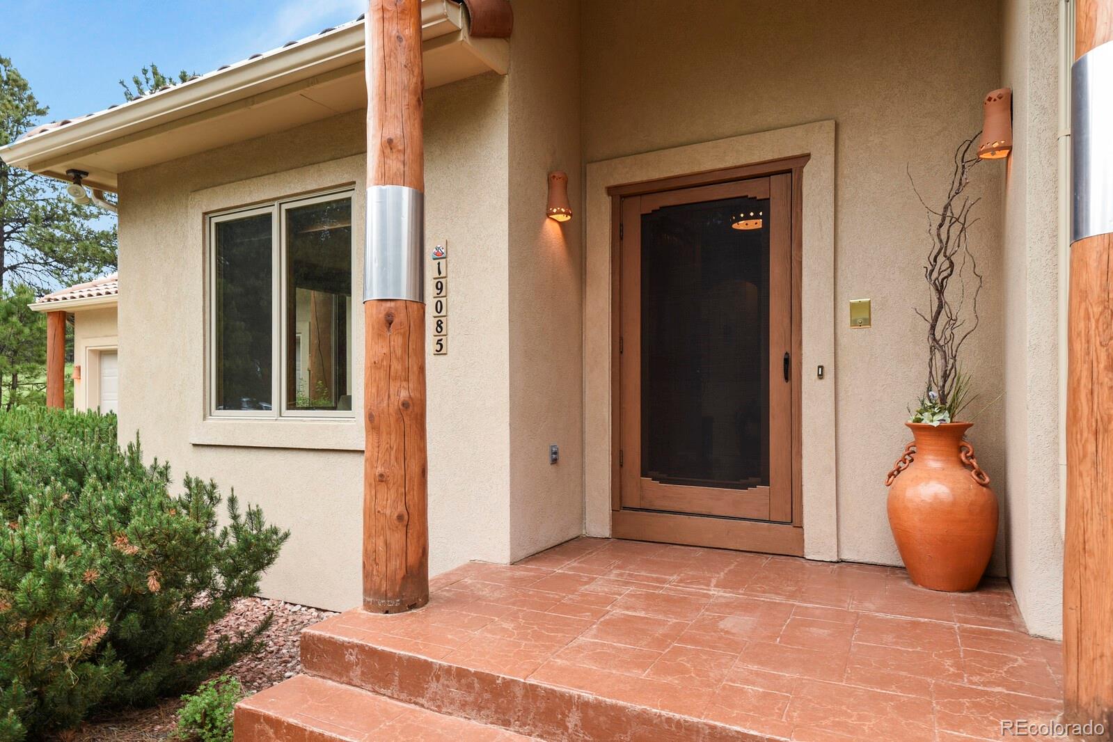19085 Merry Men Circle Monument, CO 80132 - Photo 2 of 50 a view of a front door of the house