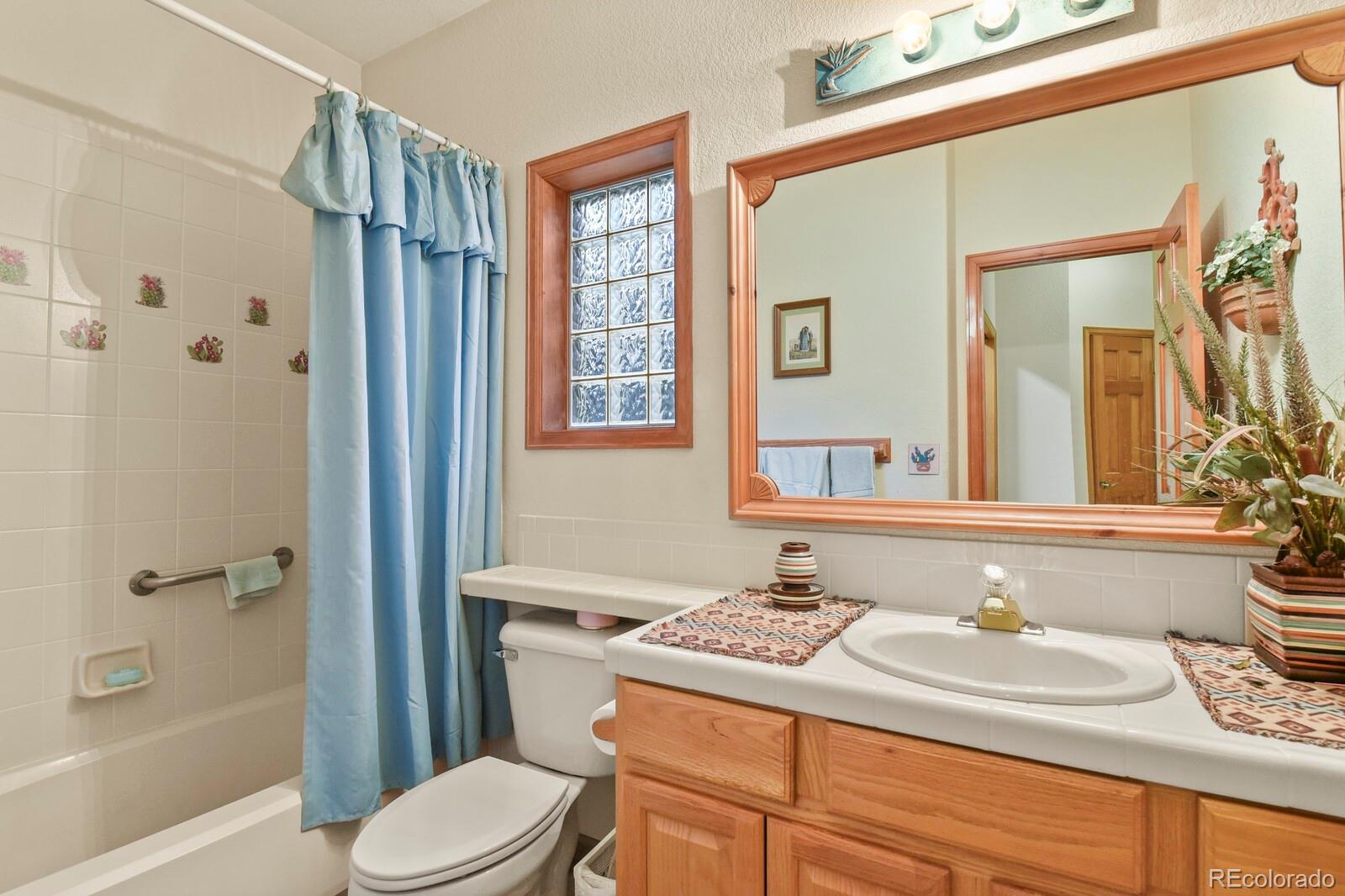 19085 Merry Men Circle Monument, CO 80132 - Photo 23 of 50 a bathroom with a sink toilet and shower