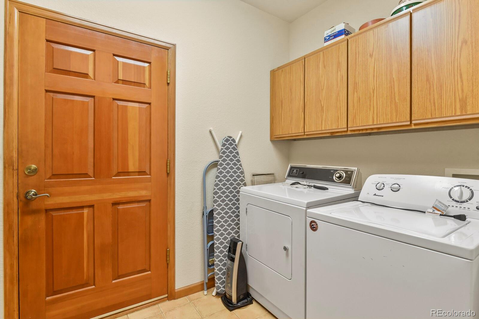 19085 Merry Men Circle Monument, CO 80132 - Photo 24 of 50 a utility room with dryer and washer