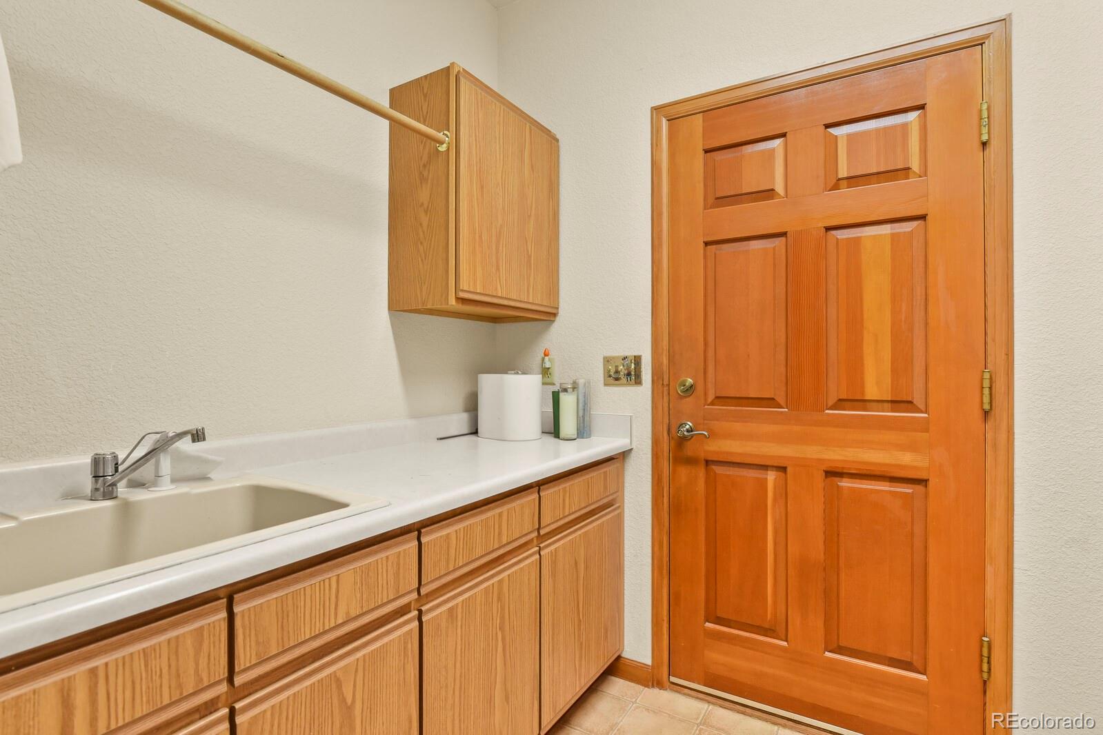 19085 Merry Men Circle Monument, CO 80132 - Photo 25 of 50 a bathroom with a sink and a mirror