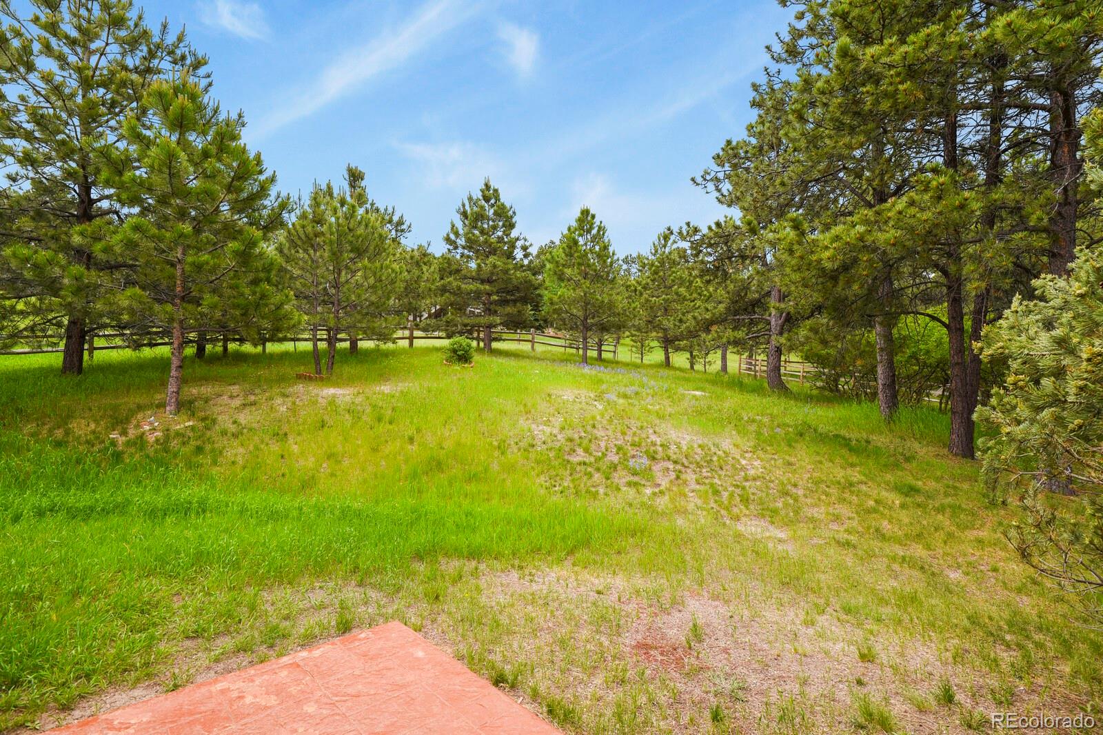 19085 Merry Men Circle Monument, CO 80132 - Photo 39 of 50 a view of a lake with houses in the background