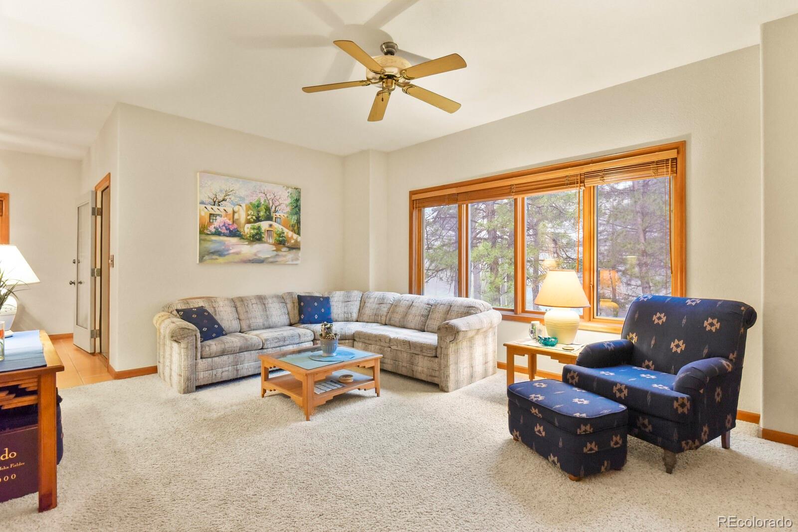 19085 Merry Men Circle Monument, CO 80132 - Photo 6 of 50 a living room with furniture and a large window