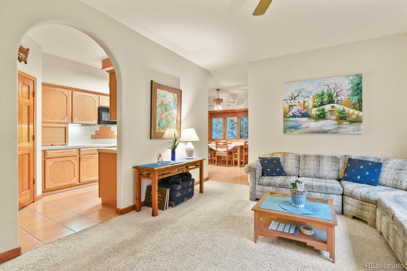 19085 Merry Men Circle Monument, CO 80132 - Photo 8 of 50 a living room with furniture and a painting on the wall
