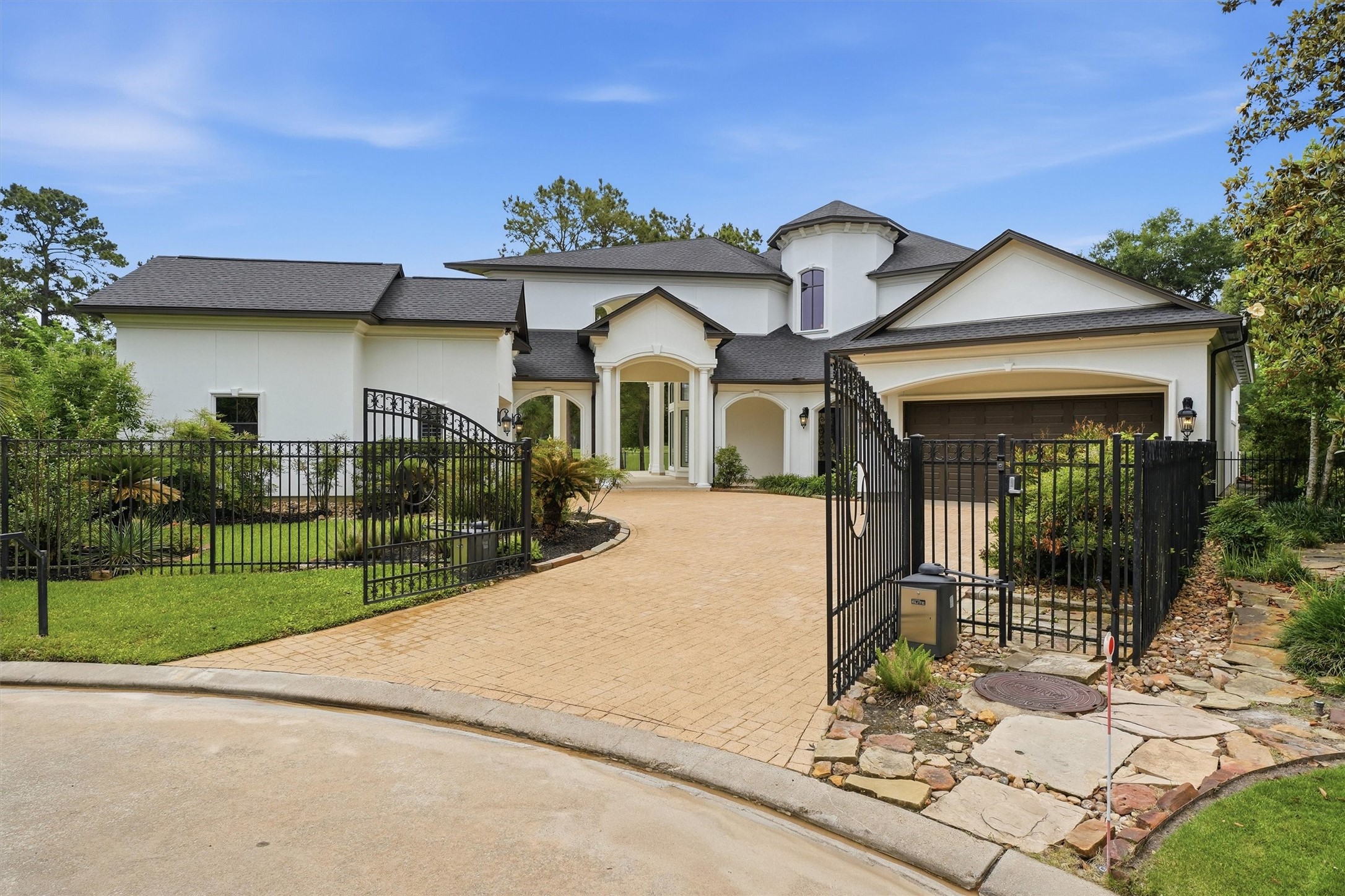 70 Quail Rock Place The Woodlands, TX 77381 - Photo 3 of 46 a front view of a house with a porch