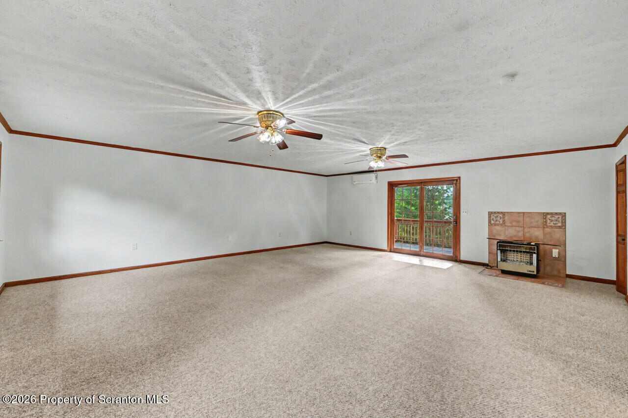 211 Buckingham Street Moscow, PA 18444 - Photo 36 of 83 an empty room with windows and fan