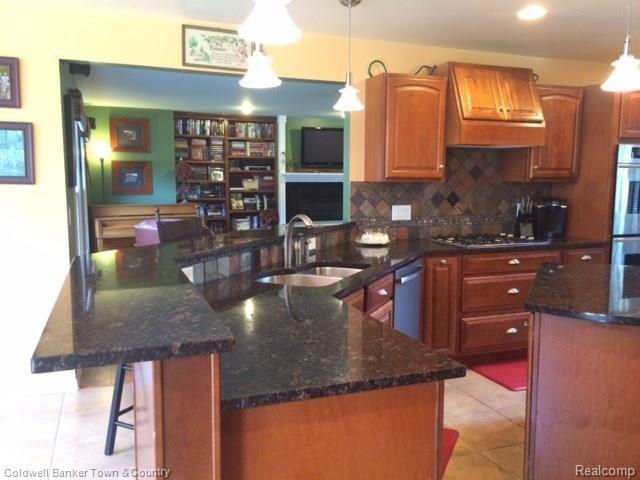 4770 Golf Club Road Howell, MI 48843 - Photo 23 of 59 Kitchen opens to Family Room