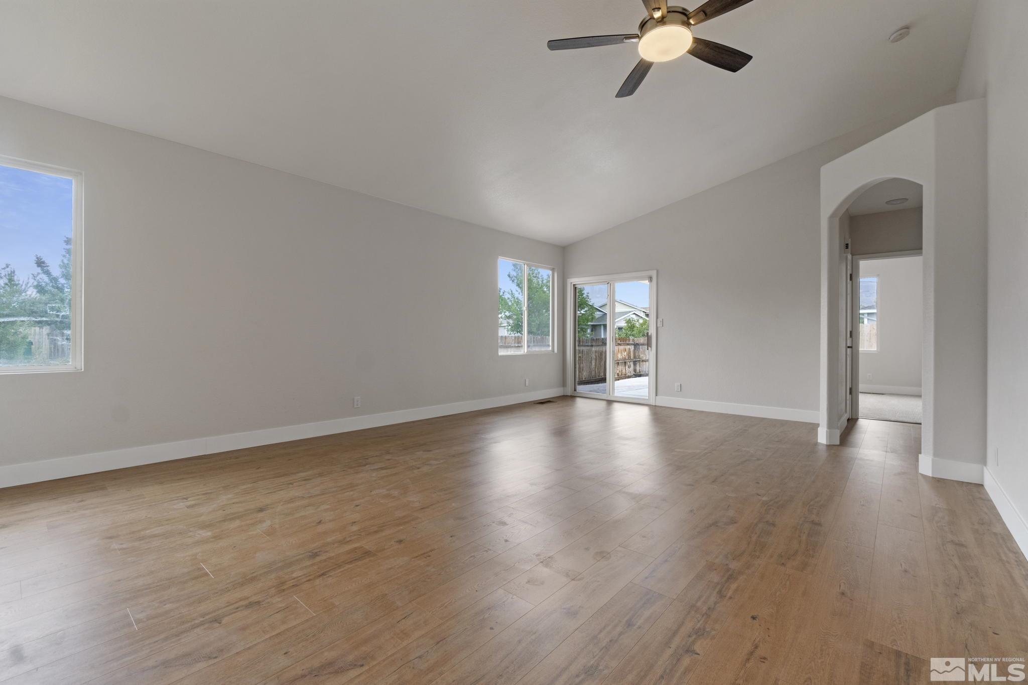 10000 Eagles Landing Court Reno, NV 89521 - Photo 5 of 37 a view of an empty room with wooden floor and a window
