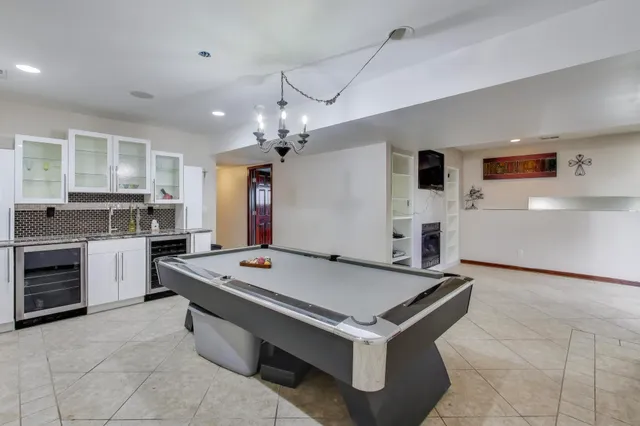 a kitchen with a stove and a refrigerator