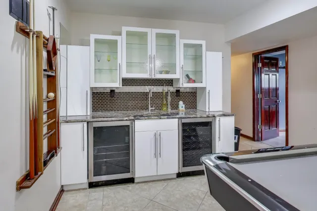 a kitchen with stainless steel appliances granite countertop a stove and a refrigerator