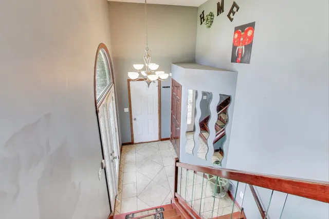 a view of a hallway with paintings on the wall