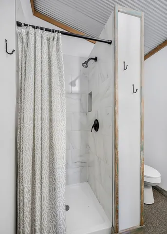 a garden with a bench and some trees