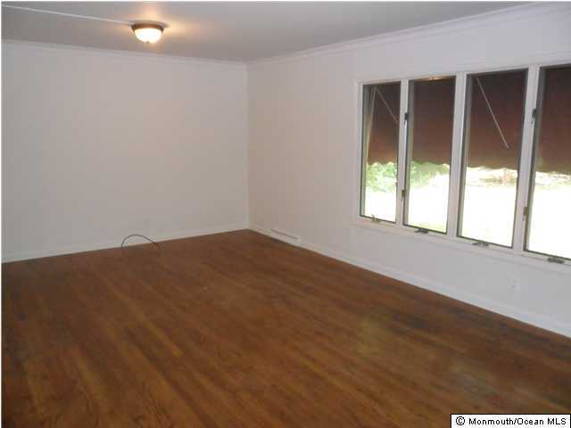 634 Fort Plains Road Howell, NJ 07731 - Photo 4 of 14 an empty room with a window
