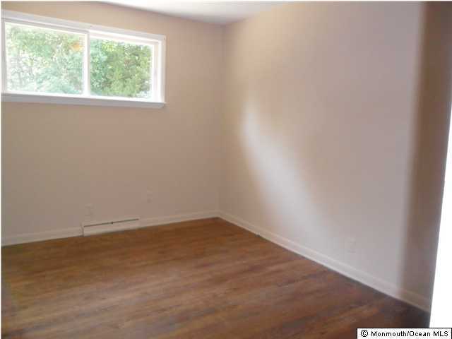 634 Fort Plains Road Howell, NJ 07731 - Photo 6 of 14 an empty room with a window