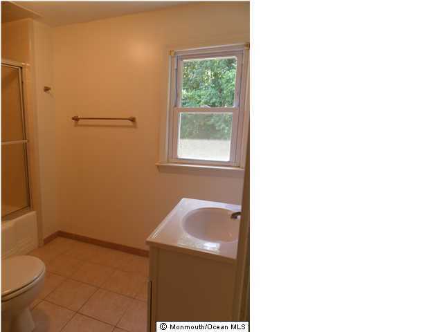 634 Fort Plains Road Howell, NJ 07731 - Photo 7 of 14 a bathroom with a toilet and a sink