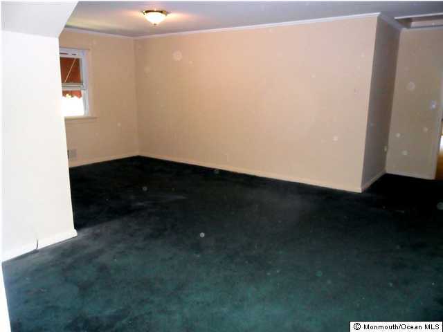 634 Fort Plains Road Howell, NJ 07731 - Photo 8 of 14 a view of an empty room and wooden floor