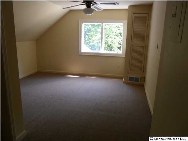 634 Fort Plains Road Howell, NJ 07731 - Photo 9 of 14 a view of room with window and a ceiling fan