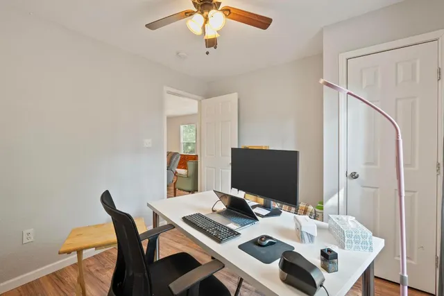 a view of a workspace with furniture