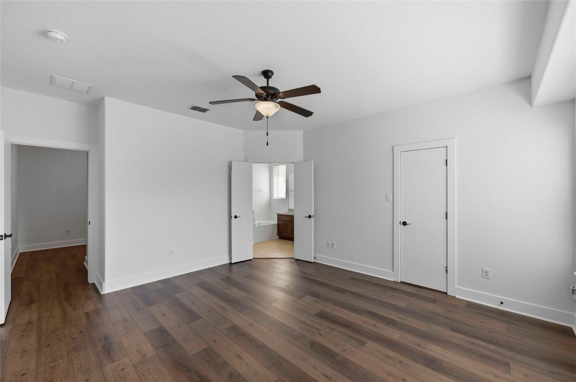 1620 Haskell Street, Unit B Austin, TX 78702 - Photo 11 of 27 a view of a room with wooden floor and ceiling fan