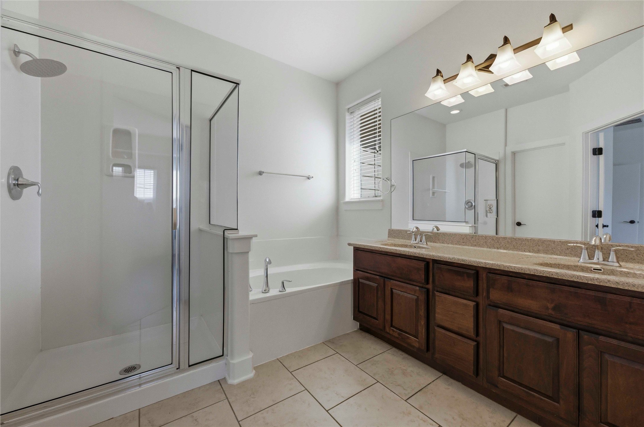 1620 Haskell Street, Unit B Austin, TX 78702 - Photo 13 of 27 a spacious bathroom with a double vanity sink mirror and shower