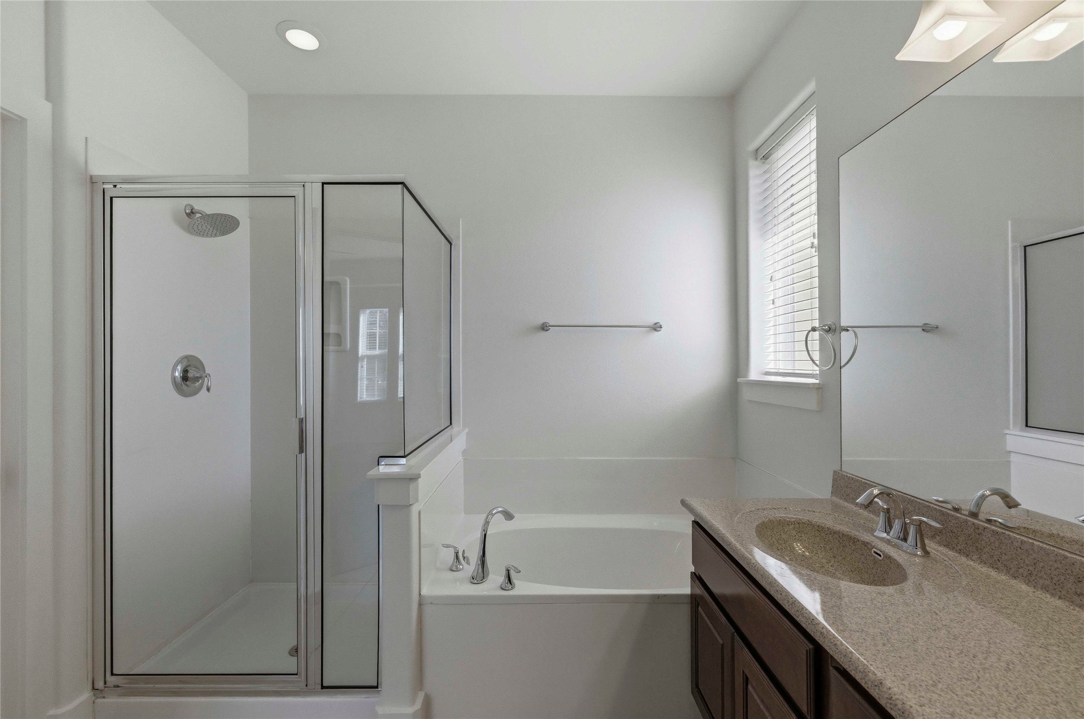 1620 Haskell Street, Unit B Austin, TX 78702 - Photo 14 of 27 a bathroom with a granite countertop sink mirror toilet and bathtub
