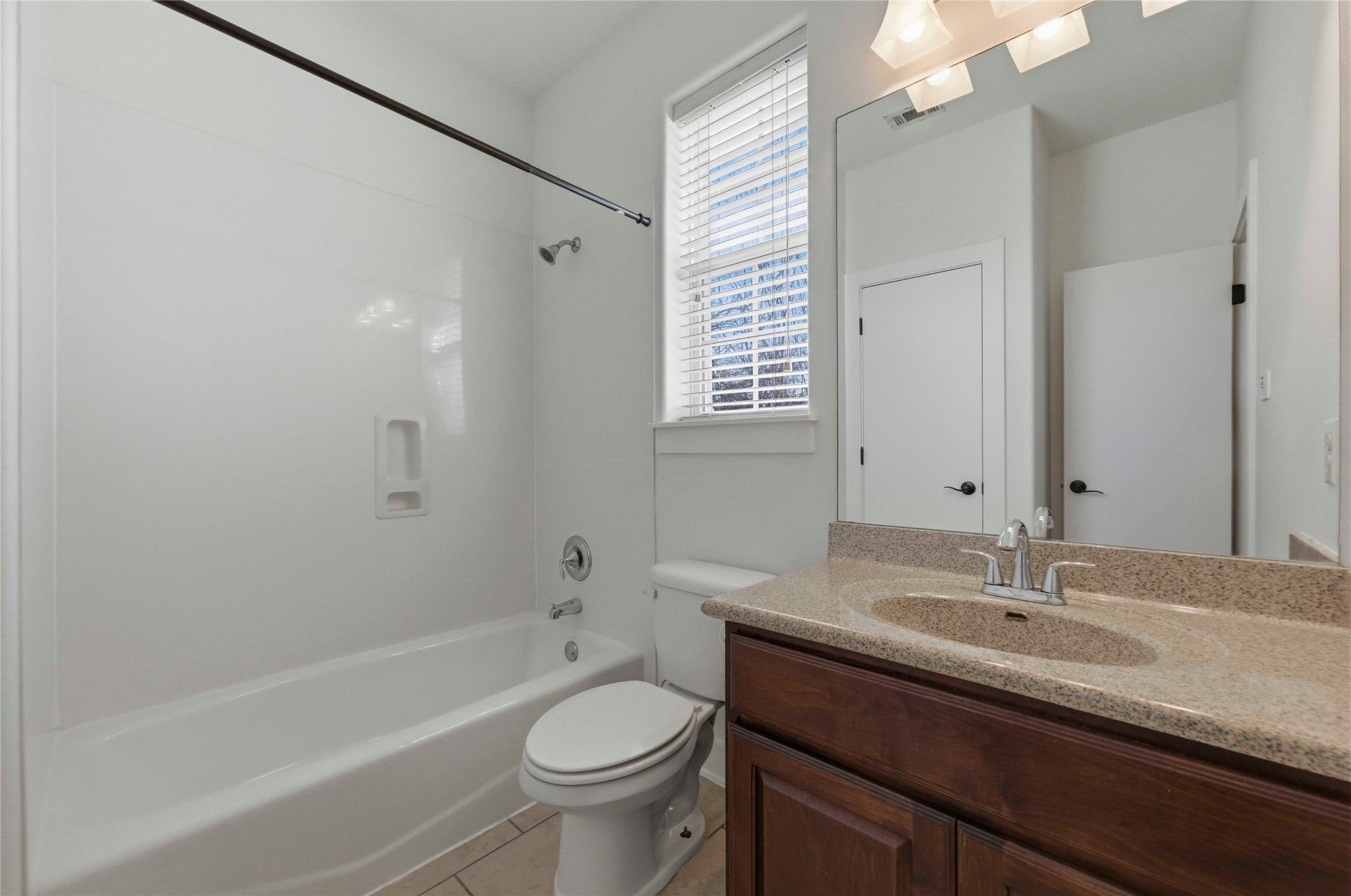 1620 Haskell Street, Unit B Austin, TX 78702 - Photo 19 of 27 a bathroom with a sink a toilet and shower