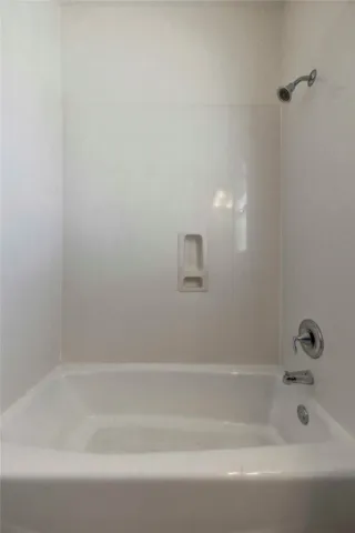 a bathroom with a sink vanity and a mirror