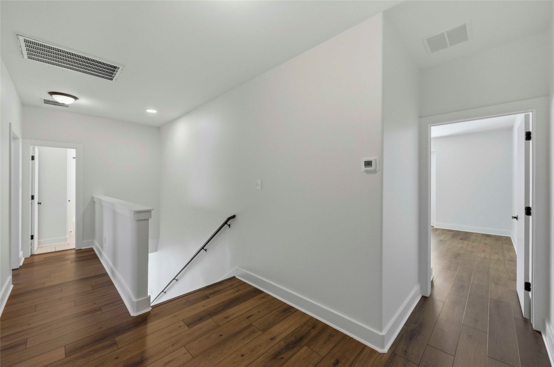 1620 Haskell Street, Unit B Austin, TX 78702 - Photo 23 of 27 a view of hallway with stairs and wooden floor