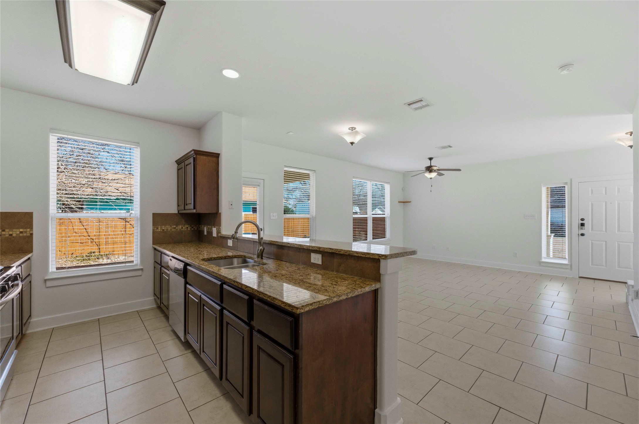 1620 Haskell Street, Unit B Austin, TX 78702 - Photo 6 of 27 a kitchen with stainless steel appliances granite countertop a sink and a stove