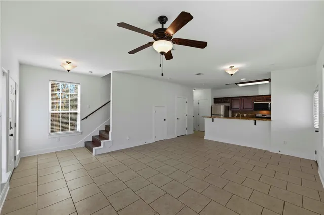 a view of a kitchen with a sink and a window