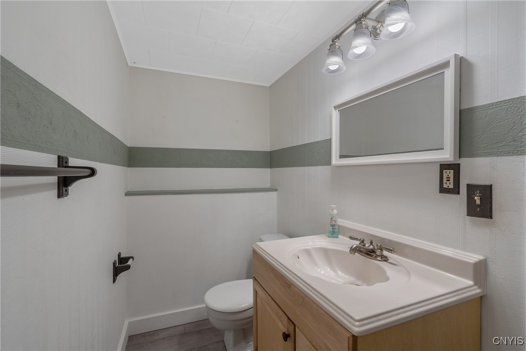 9582 Tagus Lane Cicero, NY 13029 - Photo 23 of 30 The powder room is also decorated in timeless patt