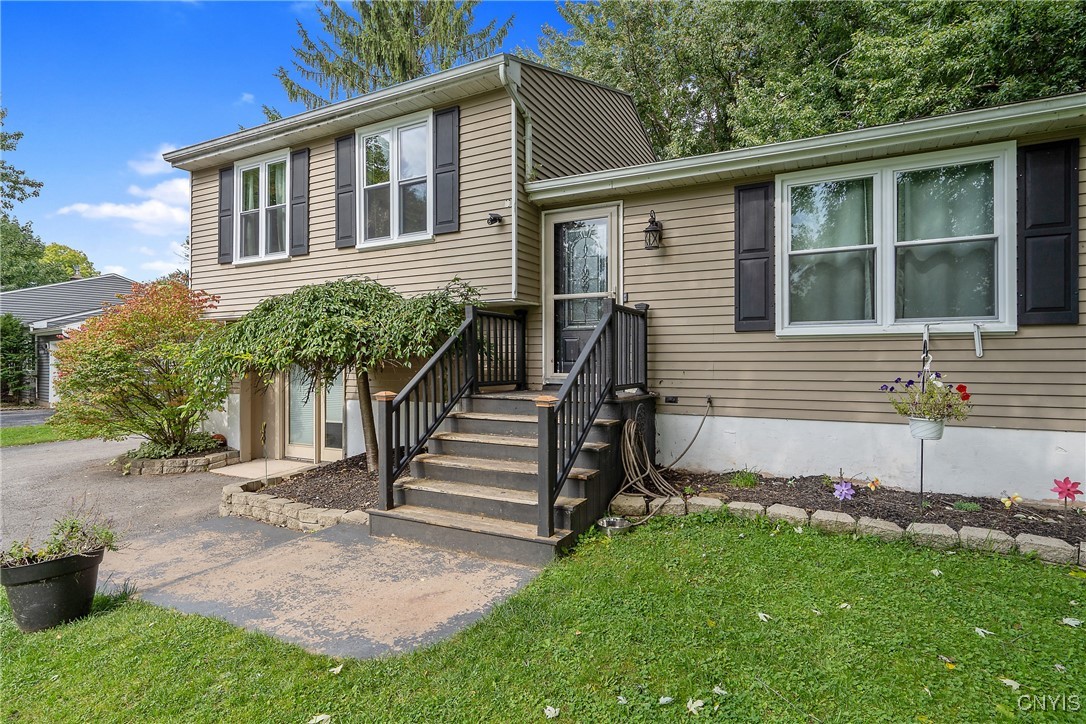 9582 Tagus Lane Cicero, NY 13029 - Photo 3 of 30 From the front, you can enter the home through the