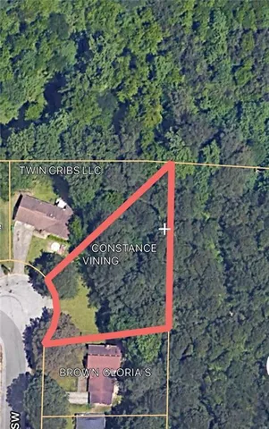 a street sign that is on a tree