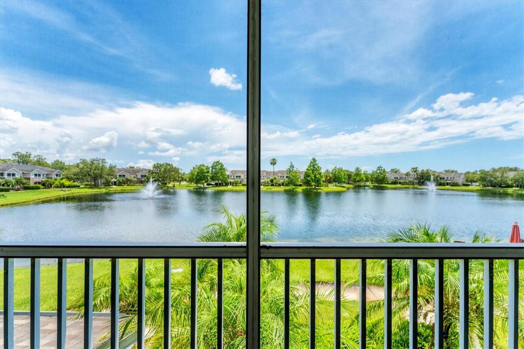 8827 Manor Loop, Unit 208 Lakewood Ranch, FL 34202 - Photo 1 of 1 a view of a lake from a balcony