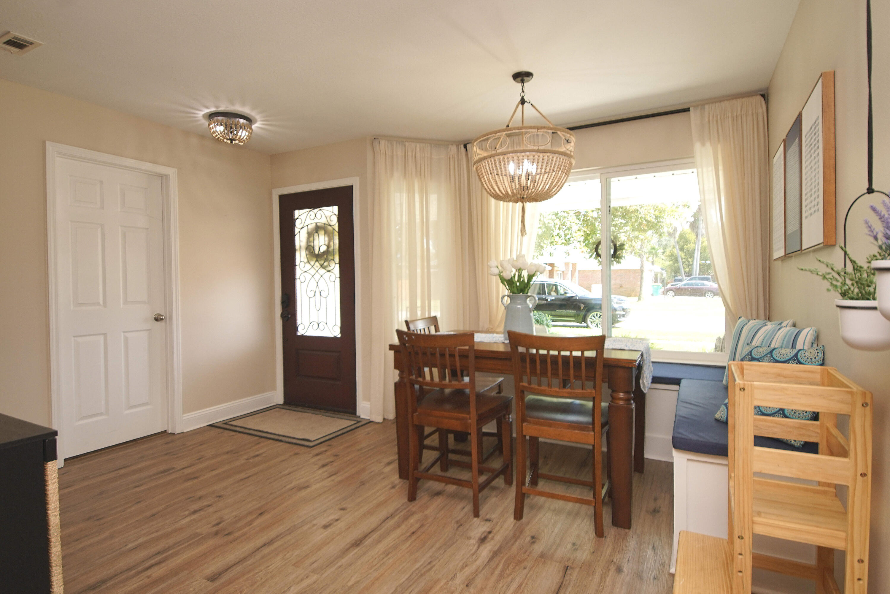 3912 Mesa Road Destin, FL 32541 - Photo 13 of 44 a view of a dining room with furniture window and wooden floor