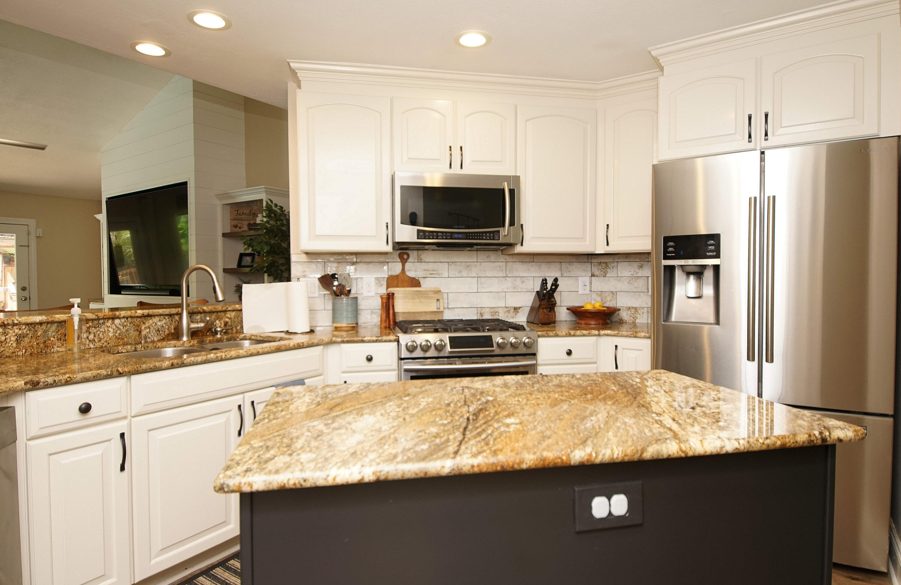 3912 Mesa Road Destin, FL 32541 - Photo 15 of 44 a kitchen with stainless steel appliances granite countertop a sink refrigerator and microwave