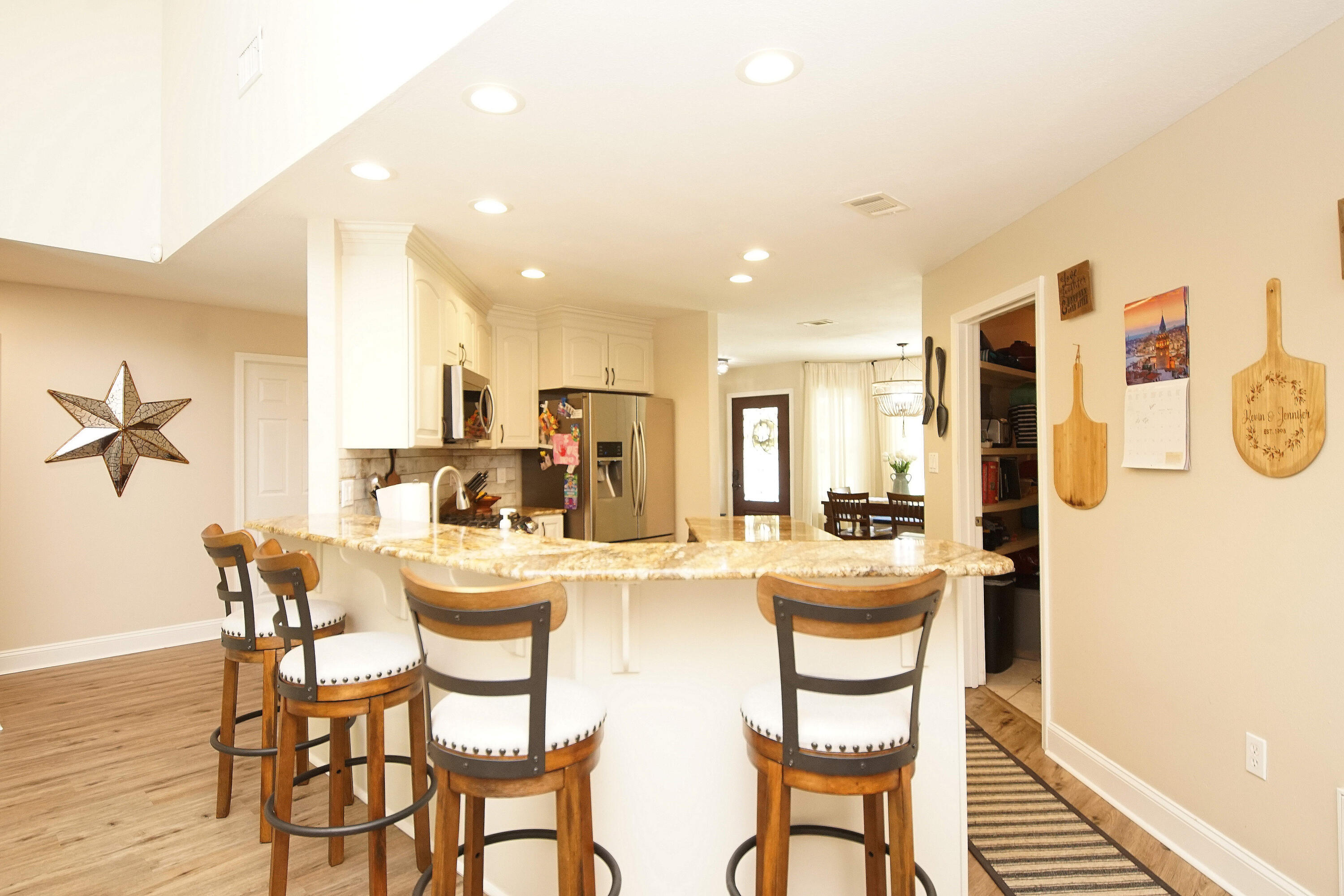 3912 Mesa Road Destin, FL 32541 - Photo 20 of 44 a dining room with furniture and a chandelier