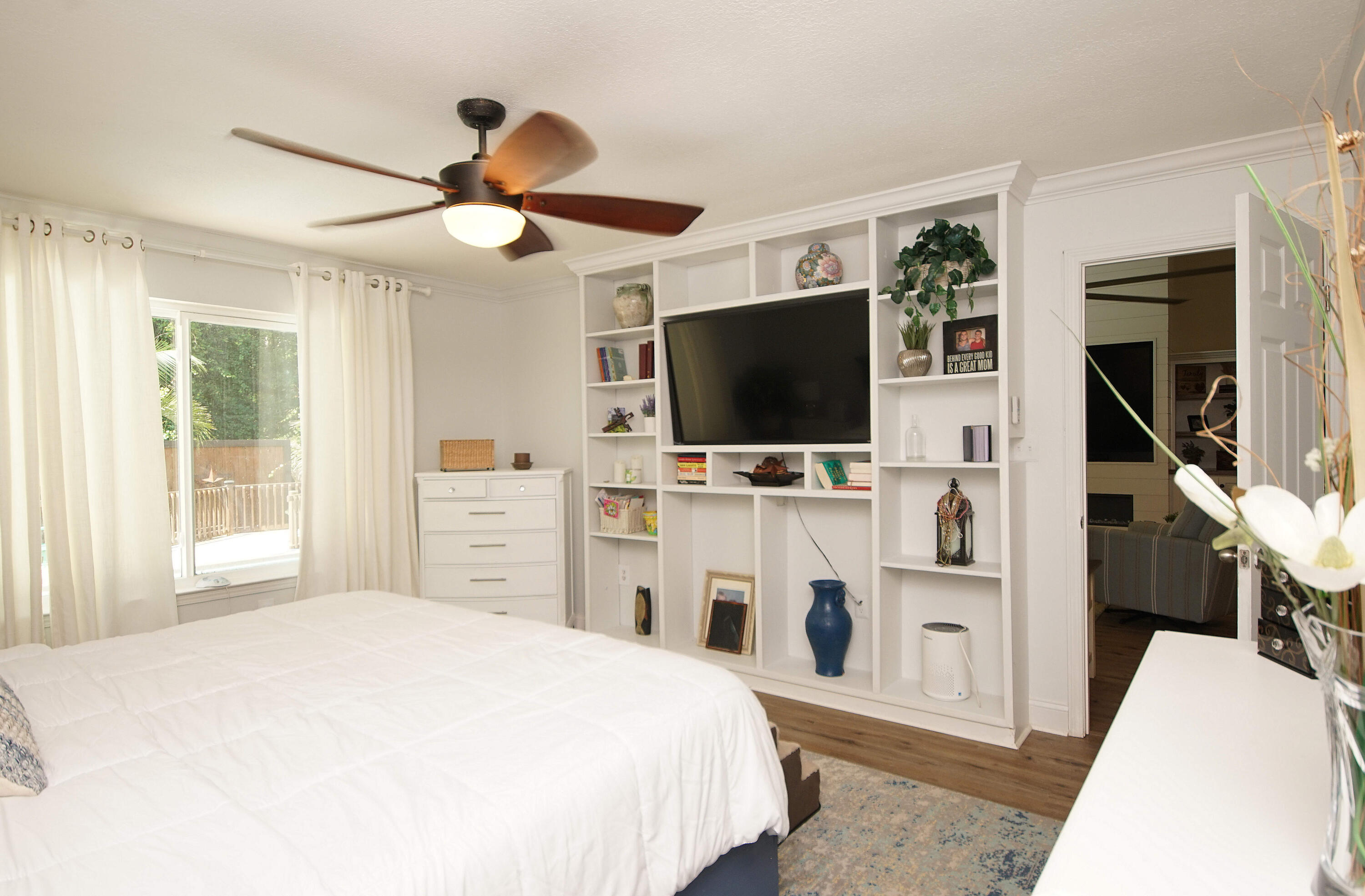 3912 Mesa Road Destin, FL 32541 - Photo 25 of 44 a bedroom with a bed and a flat tv screen on dresser