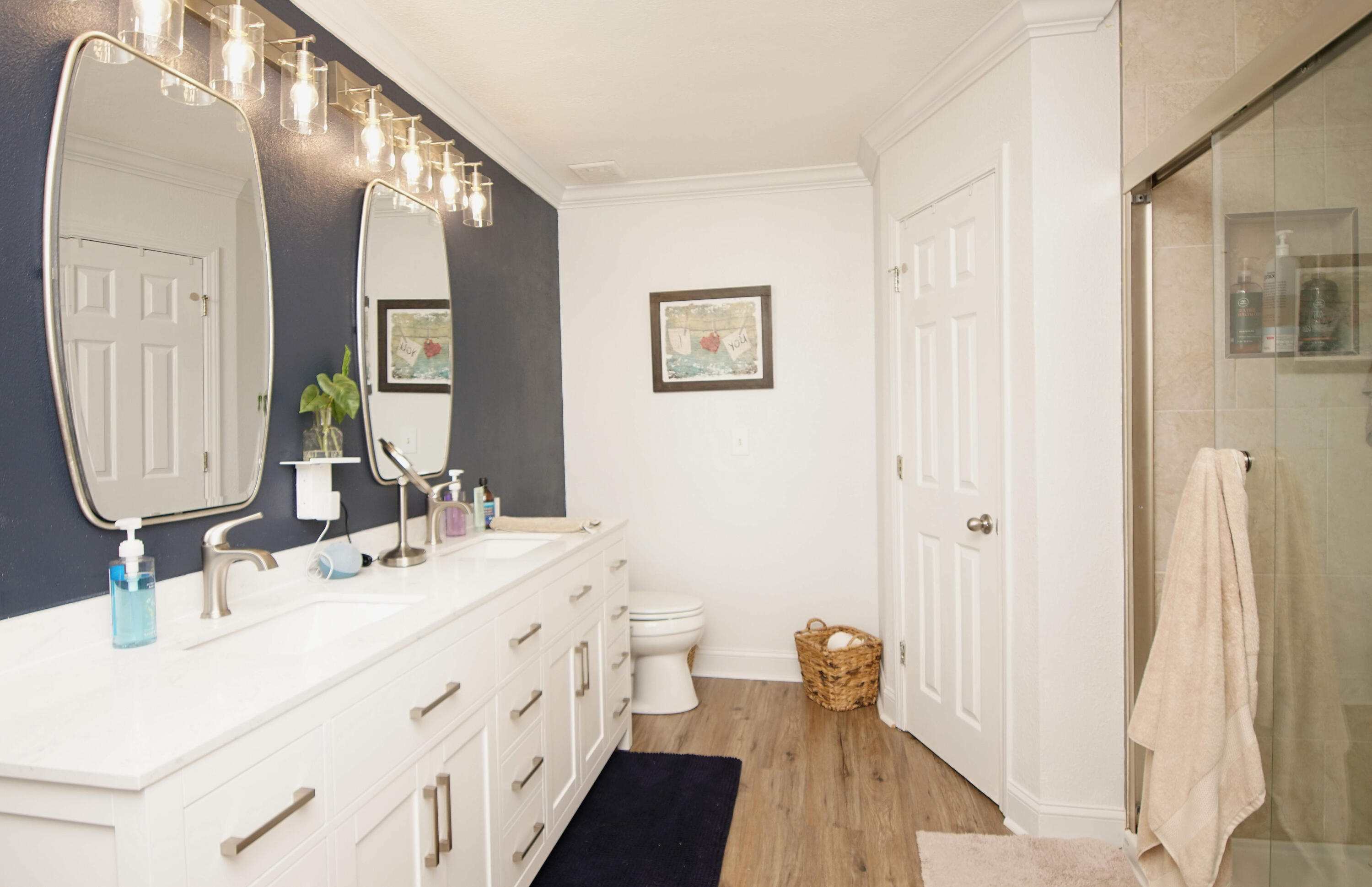 3912 Mesa Road Destin, FL 32541 - Photo 26 of 44 a bathroom with a double vanity sink and mirror