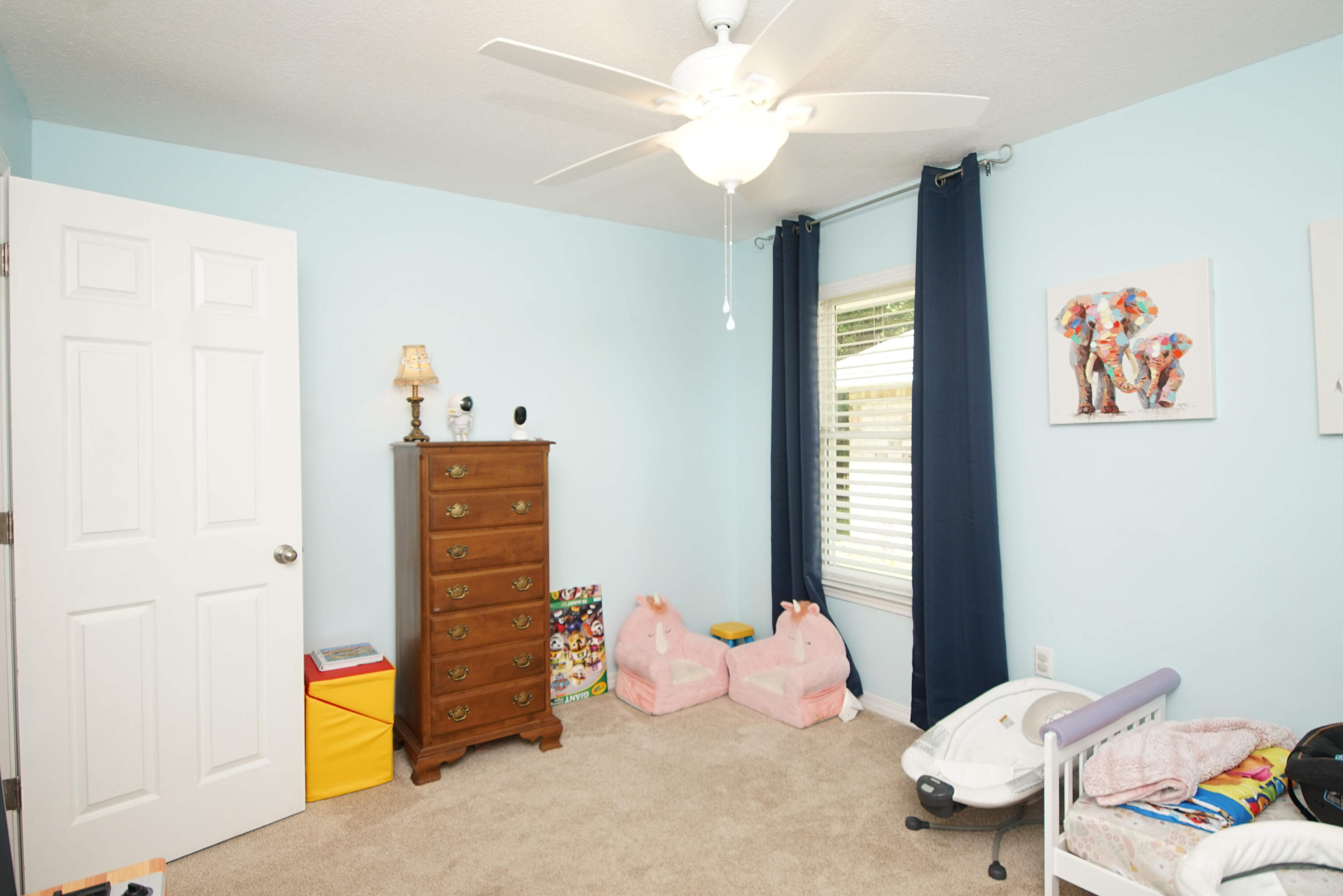 3912 Mesa Road Destin, FL 32541 - Photo 31 of 44 a bedroom with a bed and a chandelier