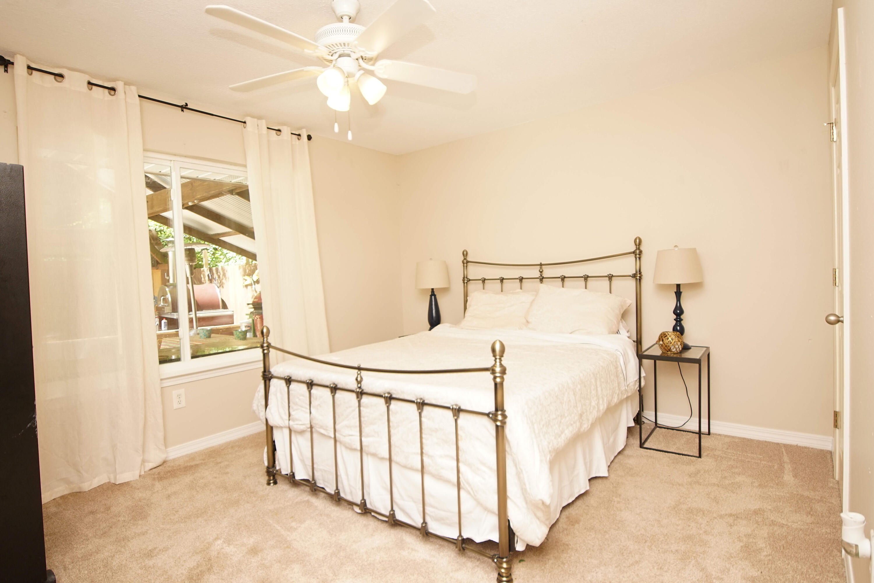 3912 Mesa Road Destin, FL 32541 - Photo 32 of 44 a bedroom with a bed and a chandelier