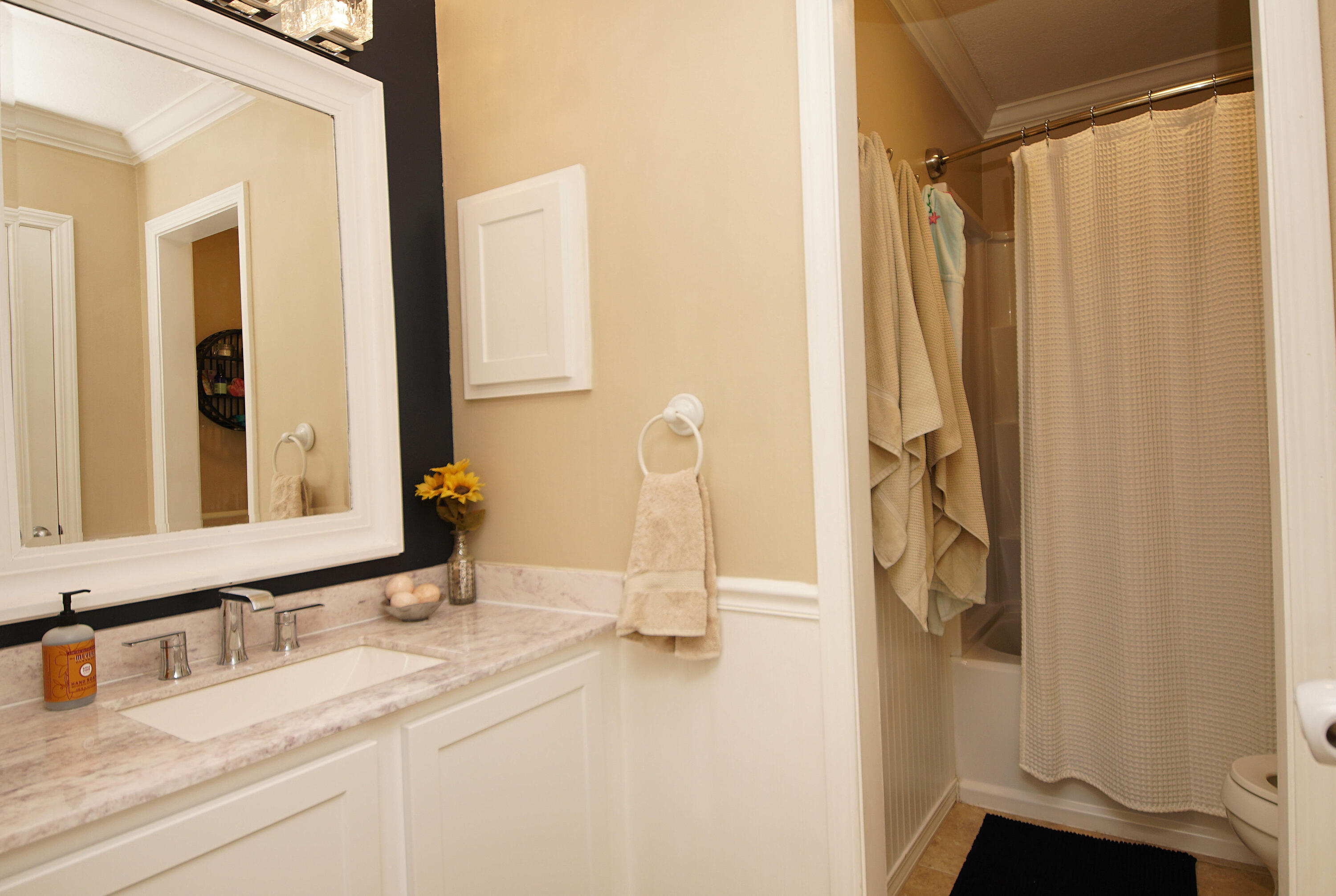 3912 Mesa Road Destin, FL 32541 - Photo 33 of 44 a bathroom with a double vanity sink and a mirror