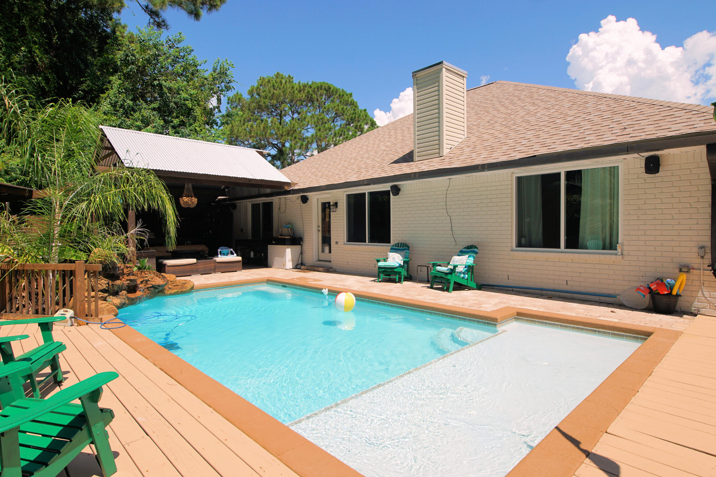 3912 Mesa Road Destin, FL 32541 - Photo 35 of 44 a view of a house with swimming pool and sitting area