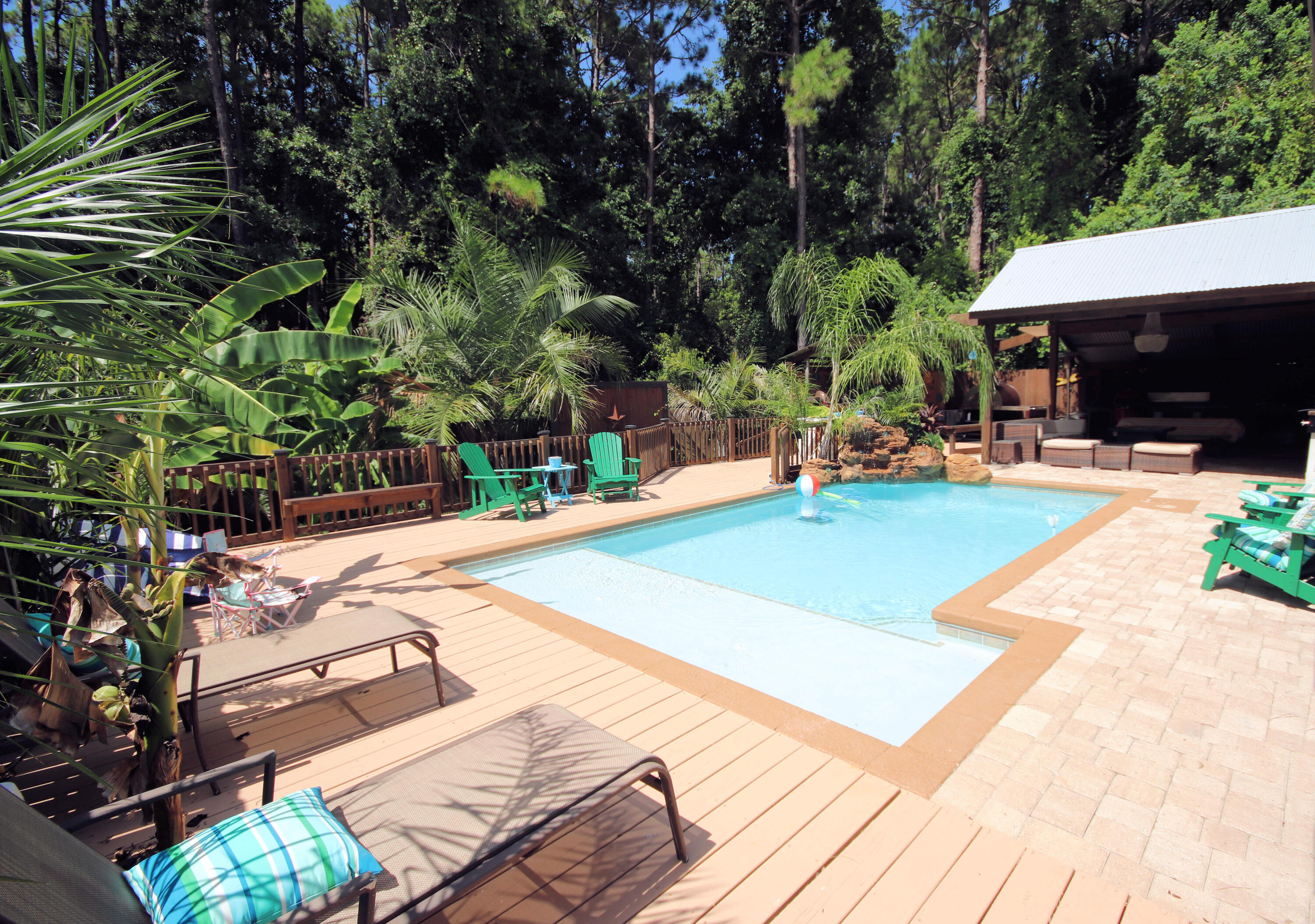 3912 Mesa Road Destin, FL 32541 - Photo 36 of 44 a swimming pool with outdoor seating and yard