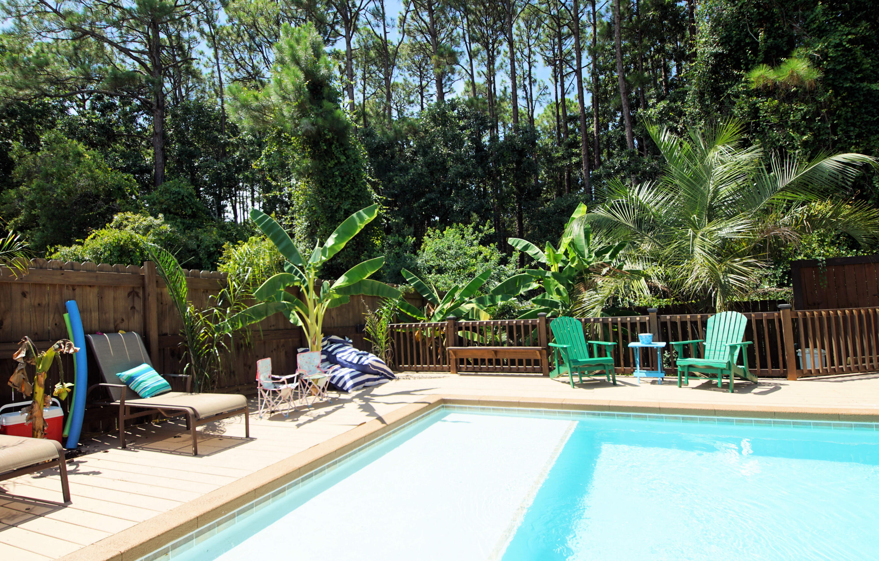 3912 Mesa Road Destin, FL 32541 - Photo 6 of 44 a view of a swimming pool with a patio and a fire pit