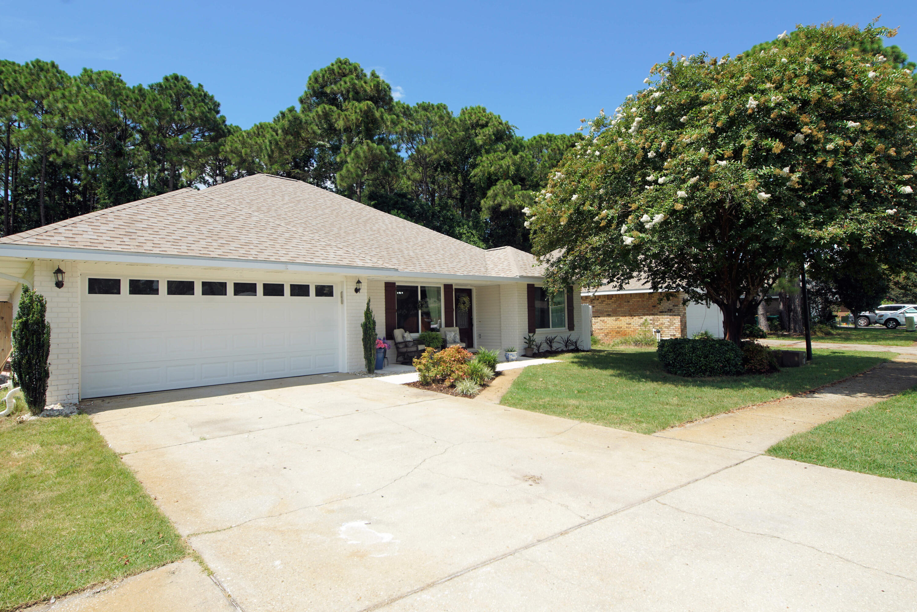3912 Mesa Road Destin, FL 32541 - Photo 8 of 44 a house with trees in the background