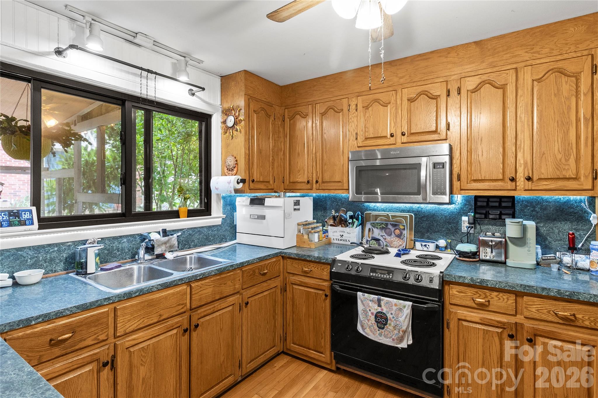 325 Swanson Road Lenoir, NC 28645 - Photo 12 of 35 a kitchen with stainless steel appliances granite countertop a sink stove and cabinets