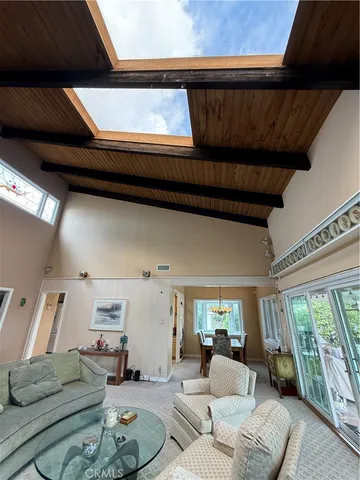 a living room with furniture and gym equipment
